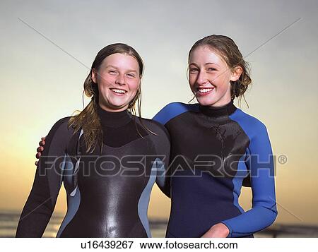 Portrait of two female surfers. View Large Photo Image Stock Photo - Portrait of two female surfers.. Fotosearch