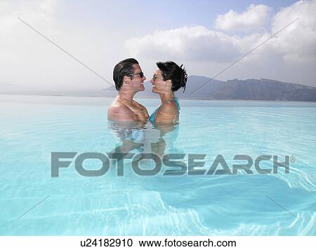 Couple in swimming pool View Large Photo Image Stock Image - Couple in swimming pool. Fotosearch