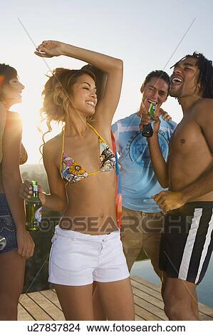 Men and women dancing on terrace View Large Photo Image Picture - Men and women dancing on terrace. Fotosearch