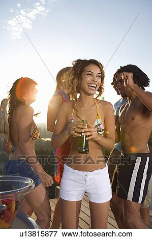 Men and women dancing on terrace View Large Photo Image Stock Photo - Men and women dancing on terrace. Fotosearch