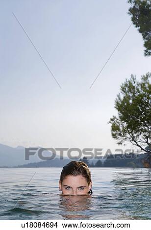 Picture - Young woman in a pool. Fotosearch