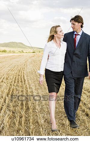Picture - Couple in a wheat field.. Fotosearch