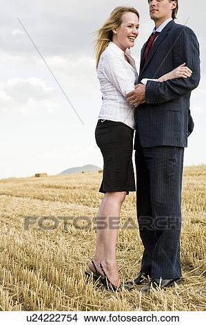 Couple in a wheat field. View Large Photo Image Picture - Couple in a wheat field.. Fotosearch