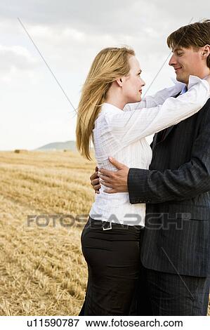 Couple in a wheat field. View Large Photo Image Stock Photo - Couple in a wheat field.. Fotosearch