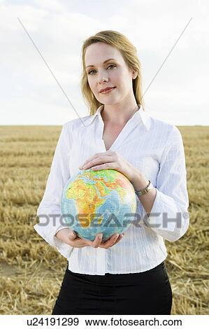 Woman with Globe in wheat field. View Large Photo Image Stock Photo - Woman with Globe in wheat field.. Fotosearch
