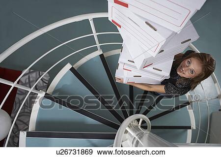 Stock Photo - Businesswoman working in an office. Fotosearch