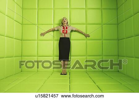 Woman laughing standing against wall of green padded cell View Large Photo Image Stock Photo - Woman laughing standing against wall of green padded cell. Fotosearch