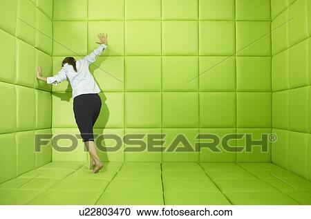 Woman pushing against walls of green padded cell View Large Photo Image Stock Image - Woman pushing against walls of green padded cell. Fotosearch
