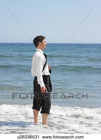 Businessman at the beach. View Large Photo Image Stock Image - Businessman at the beach.. Fotosearch