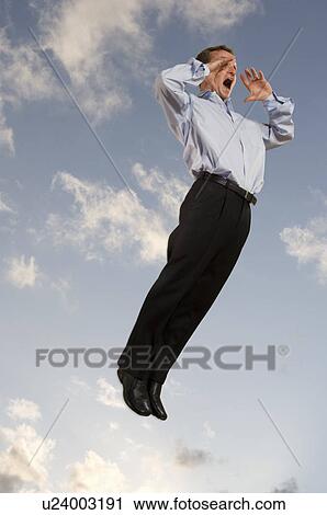 Businessman in the sky shouting View Large Photo Image Stock Image - Businessman in the sky shouting. Fotosearch