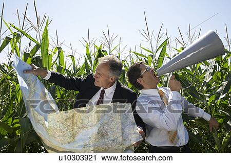 Businessmen in a cornfield with a map and megaphone. View Large Photo Image Stock Image - Businessmen in a cornfield with a map and megaphone.. Fotosearch
