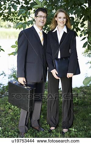 Businesspeople by a river. View Large Photo Image Picture - Businesspeople by a river.. Fotosearch
