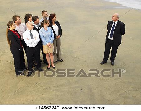 Group of businesspeople on the beach. View Large Photo Image Stock Image - Group of businesspeople on the beach.. Fotosearch