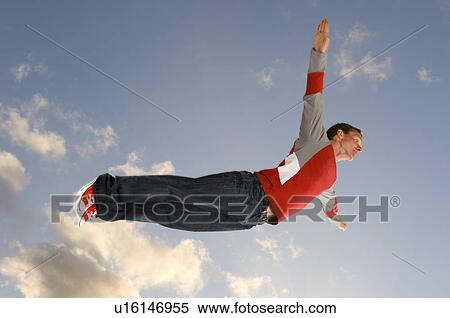 Stock Photography - Man flying through the air . Fotosearch
