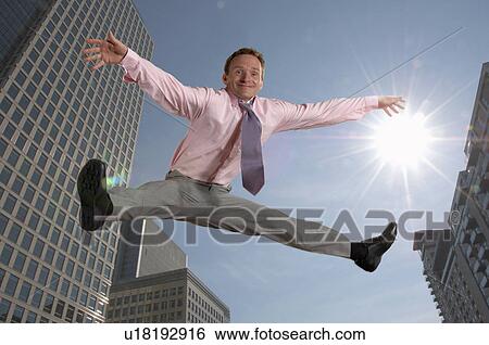 Man jumping in the air View Large Photo Image Stock Photograph - Man jumping in the air. Fotosearch