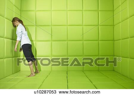 Woman pushing against walls of green padded cell View Large Photo Image Stock Image - Woman pushing against walls of green padded cell. Fotosearch