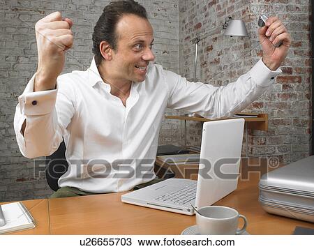 Businessman with arms raised in celebration., Brussels, Belgium. View Large Photo Image Stock Image - Businessman with arms raised in celebration., Brussels, Belgium.. Fotosearch