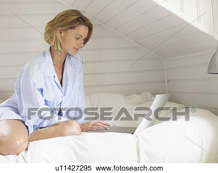 Stock Photography - Businesswoman working from home. Fotosearch