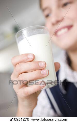 Boy drinking a glass of milk View Large Photo Image Stock Image - Boy drinking a glass of milk. Fotosearch