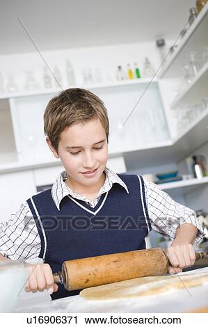 Boy preparing dough View Large Photo Image Stock Image - Boy preparing dough. Fotosearch