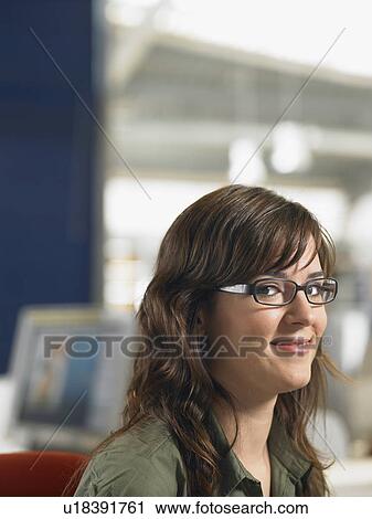 Businesswoman working in an office View Large Photo Image Stock Image - Businesswoman working in an office. Fotosearch
