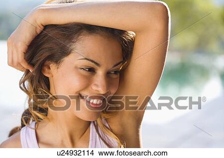 Woman smiling outdoors. View Large Photo Image Picture - Woman smiling outdoors.. Fotosearch