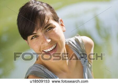 Woman smiling outdoors View Large Photo Image Stock Image - Woman smiling outdoors. Fotosearch