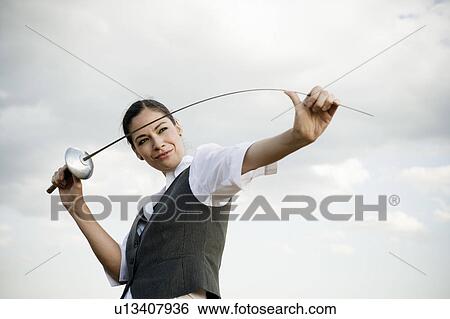 Woman with sword in wheat field. View Large Photo Image Stock Photograph - Woman with sword in wheat field.. Fotosearch