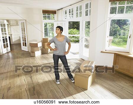 Women moving into new house. View Large Photo Image Stock Image - Women moving into new house.. Fotosearch