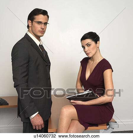 Man and woman in office, portrait View Large Photo Image Stock Image - Man and woman in office, portrait. Fotosearch