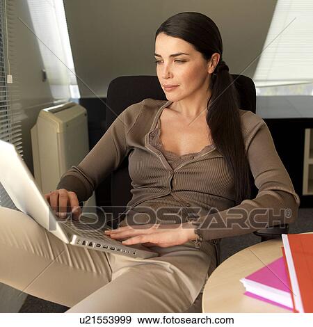 Stock Photo - Woman with laptop. Fotosearch