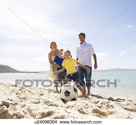 Picture - A family on a beach. Fotosearch