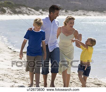 A family on a beach View Large Photo Image Stock Image - A family on a beach. Fotosearch