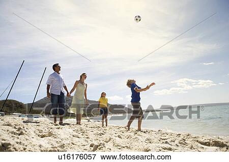 Stock Photo - A family on a beach. Fotosearch