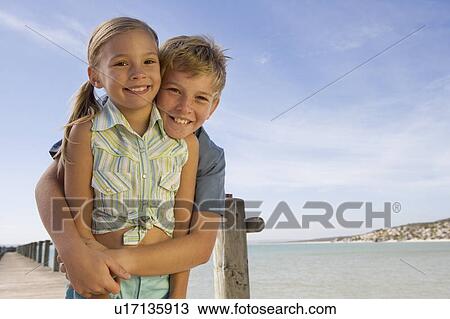 Stock Image - Two children on a beach. Fotosearch