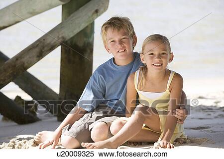 Two children on a beach View Large Photo Image Stock Photography - Two children on a beach. Fotosearch