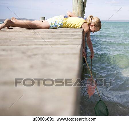 Two children with fishing nets View Large Photo Image Stock Photography - Two children with fishing nets. Fotosearch