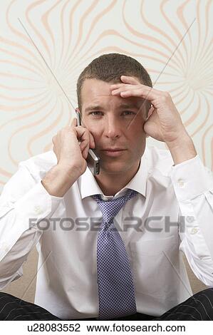 Businessman talking on the phone View Large Photo Image Stock Image - Businessman talking on the phone. Fotosearch