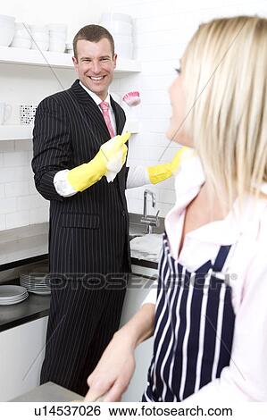 Stock Photograph - Businessman washing the dishes. Fotosearch