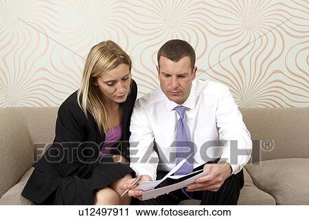 Stock Image - Couple discussing business. Fotosearch