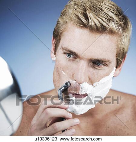 A young man shaving View Large Photo Image Stock Image - A young man shaving. Fotosearch