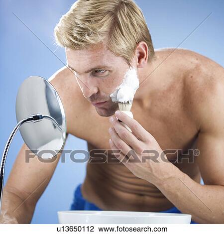 A young man shaving View Large Photo Image Stock Image - A young man shaving. Fotosearch