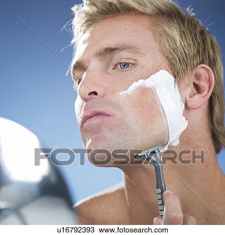 A young man shaving View Large Photo Image Stock Image - A young man shaving. Fotosearch