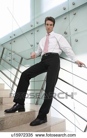 Stock Photography - A business standing on stairs. Fotosearch