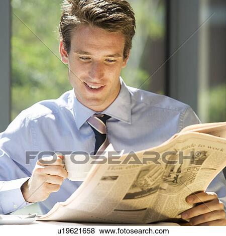 A businessman reading a paper View Large Photo Image Stock Photo - A businessman reading a paper. Fotosearch