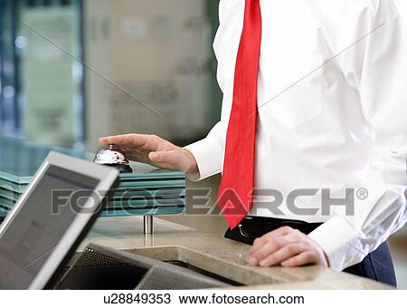 A businessman ringing a bell for attention View Large Photo Image Stock Image - A businessman ringing a bell for attention. Fotosearch