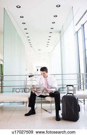 A businessman waiting at an airport View Large Photo Image Stock Photo - A businessman waiting at an airport. Fotosearch