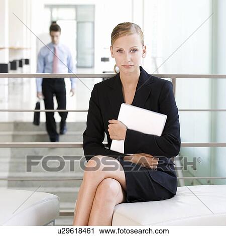 A businesswoman waiting with a laptop View Large Photo Image Stock Image - A businesswoman waiting with a laptop. Fotosearch