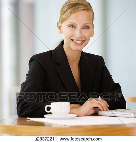 A businesswomen drinking coffee View Large Photo Image Stock Image - A businesswomen drinking coffee. Fotosearch