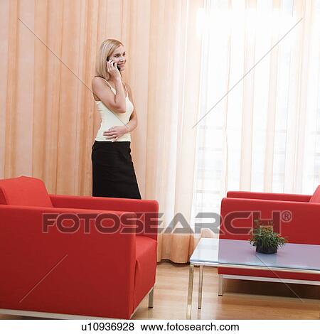 A woman stood in a hotel room View Large Photo Image Stock Photo - A woman stood in a hotel room. Fotosearch